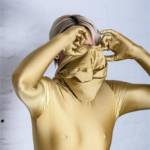 Zentai girl in golden zentai suit