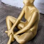 Zentai girl in golden zentai suit