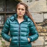 Megan in a green shiny Moncler